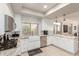 Well-lit kitchen features stainless steel appliances, a farmhouse sink, and stylish countertops at 14058 S 24Th Way, Phoenix, AZ 85048