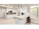 Bright kitchen with stainless steel appliances, white cabinetry, and a stylish breakfast bar with seating at 14058 S 24Th Way, Phoenix, AZ 85048