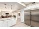 Open kitchen featuring stainless steel refrigerator, leading to dining and living spaces at 14058 S 24Th Way, Phoenix, AZ 85048