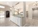 Spacious open-concept living area featuring a bar and dining room with outside views at 14058 S 24Th Way, Phoenix, AZ 85048