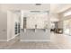 Open-concept living area featuring a bar counter with stylish pendant lighting at 14058 S 24Th Way, Phoenix, AZ 85048