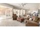 Spacious living room with comfortable seating, open layout, and access to an outdoor patio at 14058 S 24Th Way, Phoenix, AZ 85048