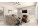 Inviting living room featuring a fireplace, ceiling fan, and comfortable seating, perfect for relaxation at 14058 S 24Th Way, Phoenix, AZ 85048