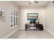 Office with neutral walls, tile floors, large window and dark wood desk at 14058 S 24Th Way, Phoenix, AZ 85048