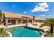 Gorgeous backyard pool area with desert landscaping, outdoor seating, and travertine decking at 14058 S 24Th Way, Phoenix, AZ 85048