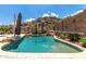 Backyard pool surrounded by desert landscaping and mountain views, ideal for relaxation and outdoor entertaining at 14058 S 24Th Way, Phoenix, AZ 85048