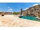 Relaxing backyard pool with tanning deck, built in seating and lush landscaping at 14058 S 24Th Way, Phoenix, AZ 85048