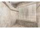 Beautifully tiled shower featuring a glass block window at 14058 S 24Th Way, Phoenix, AZ 85048