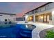 Exterior elevation of home featuring an in-ground pool with spa and outdoor firepit at 14494 W Yucatan St, Surprise, AZ 85379