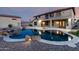 View of the backyard featuring an in-ground pool and outdoor firepit at 14494 W Yucatan St, Surprise, AZ 85379