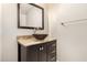 Bathroom featuring stone countertop vanity with bowl sink, framed mirror, and brushed nickel hardware at 14494 W Yucatan St, Surprise, AZ 85379