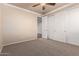 Bedroom with neutral walls and carpet and a sliding closet door at 14494 W Yucatan St, Surprise, AZ 85379