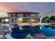 Exterior elevation of home featuring an in-ground pool with spa and outdoor firepit at 14494 W Yucatan St, Surprise, AZ 85379