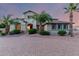 Charming home featuring desert landscaping, a brick driveway, and delightful turquoise shutters at 14494 W Yucatan St, Surprise, AZ 85379