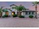 Charming home featuring desert landscaping, a brick driveway, and delightful turquoise shutters at 14494 W Yucatan St, Surprise, AZ 85379