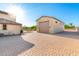 Detached garage with ample parking space and a well-maintained driveway at 14494 W Yucatan St, Surprise, AZ 85379