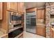 Kitchen features stainless appliances, granite counters, built in microwave and oven at 14494 W Yucatan St, Surprise, AZ 85379