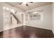 Living room showcasing staircase, clerestory windows, and view to adjoining room with hardwood flooring at 14494 W Yucatan St, Surprise, AZ 85379