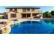 Stunning pool and spa combination with rock accents and a built-in fire pit at 14494 W Yucatan St, Surprise, AZ 85379