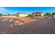 Large lot with ample space, including the home, detached garage, and space for activities at 14494 W Yucatan St, Surprise, AZ 85379