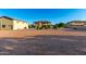 Spacious lot featuring a well-maintained home, detached garage, and mature landscaping at 14494 W Yucatan St, Surprise, AZ 85379