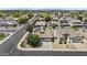 An aerial view showcasing the home, neighborhood, solar panels, and proximity to local amenities at 14676 W Banff Ln, Surprise, AZ 85379