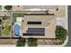 Aerial view of a single Gathering home with a swimming pool and solar panels at 14676 W Banff Ln, Surprise, AZ 85379
