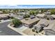An elevated view of the home highlighting curb appeal, mature trees, and neighborhood layout at 14676 W Banff Ln, Surprise, AZ 85379