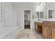 Bathroom with tub, shower, double vanity and walk-in closet at 14676 W Banff Ln, Surprise, AZ 85379