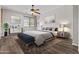 Stylishly decorated bedroom with large bed and coordinating furniture at 14676 W Banff Ln, Surprise, AZ 85379