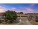 Charming single-story home with a three-car garage and well-maintained landscaping at 14676 W Banff Ln, Surprise, AZ 85379