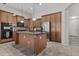 Modern kitchen with stainless steel appliances and a central island for meal prep and gatherings at 14676 W Banff Ln, Surprise, AZ 85379