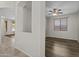 Living room with hardwood floors and natural light from window at 14676 W Banff Ln, Surprise, AZ 85379