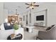 Cozy living space with tile floors and an open layout, seamlessly connecting the kitchen and dining at 14676 W Banff Ln, Surprise, AZ 85379