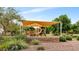 Community playground with a large shade canopy over a slide and climbing structures at 14676 W Banff Ln, Surprise, AZ 85379