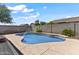 A well-maintained pool with concrete surround, perfect for relaxation and outdoor enjoyment at 14676 W Banff Ln, Surprise, AZ 85379