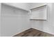 Empty walk-in closet featuring white walls and shelving at 14676 W Banff Ln, Surprise, AZ 85379