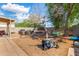 Large backyard featuring grill, hammock, trampoline, and desert landscaping at 1507 W Mesquite Ave, Apache Junction, AZ 85120