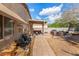 Charming backyard with a covered patio, spa, outdoor furniture, and a trampoline at 1507 W Mesquite Ave, Apache Junction, AZ 85120