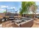 Spacious backyard featuring a trampoline, outdoor seating area, and lush landscaping at 1507 W Mesquite Ave, Apache Junction, AZ 85120