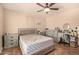 Bedroom with neutral walls, wood-look tile flooring and bright natural light at 1507 W Mesquite Ave, Apache Junction, AZ 85120