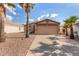 Charming single-story home showcasing a well-maintained exterior and desert landscaping at 1507 W Mesquite Ave, Apache Junction, AZ 85120