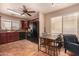 Updated kitchen with stainless steel appliances, dark cabinetry, and a cozy dining area at 1507 W Mesquite Ave, Apache Junction, AZ 85120