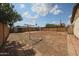 Large backyard with a shed, clothesline, block perimeter wall, and potential for landscaping or outdoor activities at 1614 S 6Th Ave, Phoenix, AZ 85003