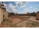 Spacious backyard featuring a block perimeter wall, shed, and partial brick patio ready for customization at 1614 S 6Th Ave, Phoenix, AZ 85003