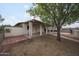Spacious backyard with mature tree providing shade and privacy, ideal for outdoor activities at 1614 S 6Th Ave, Phoenix, AZ 85003