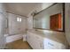 Full bathroom with a tub, shower, and vanity, offering essential amenities at 1614 S 6Th Ave, Phoenix, AZ 85003