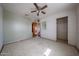 Bedroom with tile floors, closet, and a door at 1614 S 6Th Ave, Phoenix, AZ 85003