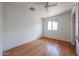 Bright bedroom featuring wood floors, a ceiling fan, and a window offering natural light at 1614 S 6Th Ave, Phoenix, AZ 85003