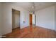 Bedroom with hardwood floors, closet, and access to the rest of the home at 1614 S 6Th Ave, Phoenix, AZ 85003